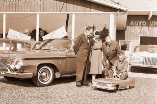 ##(Oct. 21, 1960) Link Spooner of Sheridan tries out the little Plymouth Fury junior size, won by his aunt, Mrs. Fred Spooner, (center), in a national contest sponsored by the Post division of General Foods. Rusty Applegate, McMinnville Plymouth-Valiant dealer (left) and Walter Grapp, representative of the division, examine the vehicle. ##(Oct. 21, 1960) Link Spooner of Sheridan tries out the little Plymouth Fury junior size, won by his aunt, Mrs. Fred Spooner, (center), in a national contest sponsored by the Post division of General Foods. Rusty Applegate, McMinnville Plymouth-Valiant dealer (left) and Walter Grapp, representative of the division, examine the vehicle.