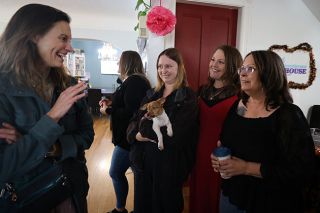 Rachel Thompson/News-Register##Oregon Criminal Justice Commissioner Holly Harris says goodbye to Henderson House staff members following a tour. From left are Prevention and Outreach Program Manager Zoë Owen, holding Toby, a 4-month-old emotional support dog and Henderson House “ambassador”; Richelle Garza, bilingual DHS co-located advocate; and Rhonda Marron, sexual assault advocate. Rachel Thompson/News-Register##Oregon Criminal Justice Commissioner Holly Harris says goodbye to Henderson House staff members following a tour. From left are Prevention and Outreach Program Manager Zoë Owen, holding Toby, a 4-month-old emotional support dog and Henderson House “ambassador”; Richelle Garza, bilingual DHS co-located advocate; and Rhonda Marron, sexual assault advocate.