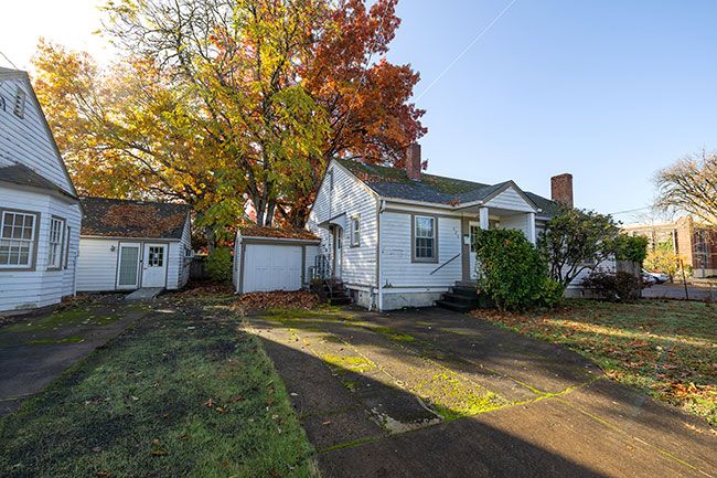 Rachel Thompson/News-Register##Yamhill County plans to demolish two houses currently used as offices to construct an eight-unit studio apartment building. The Northeast Seventh Street facility will assist those deemed unfit for court in regaining their competence through counseling and treatment.