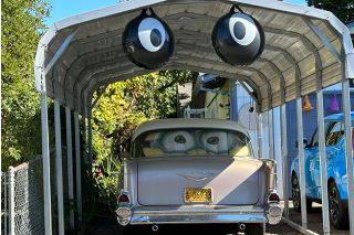 Kirby Neumann-Rea/News-Register##Two pairs of eyes peer out from a carport on Southeast Villard Street.