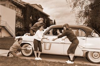 ##(Nov. 4, 1955) McMinnville High School gals get ready for their annual Fun-d Week, designed to raise funds for the school’s Girls Athletic Association. All types of jobs will be handled by the girls for a fee, including such chores as car washing, leaf raking, house cleaning, window washing, and clerical work. Putting the finishing polish on this car are (left to right) Darlene Kroll, Connie Howard, Marleah Compton, Nancy Jenne, and Jean Meierotto.