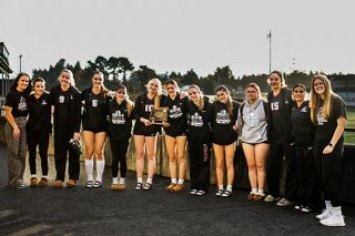 Photo courtesy of Sam Alexander##The Dayton volleyball team poses for a photo outside of North Bend High School in Coos Bay while sporting their fifth-place trophy. They also earned the OSAA Sportsmanship Award.