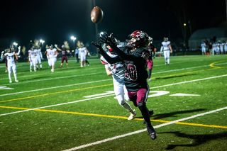 Rusty Rae/News-Register##Junior wide receiver Nate Coburn (No. 10) hauls in a pass from senior quarterback Ryan Mullins just short of the end zone during the Pirates first-round game against Douglas at Dayton High School on Friday, Nov. 7. It was Dayton’s first pass attempt and set up a short touchdown run by Mullins.