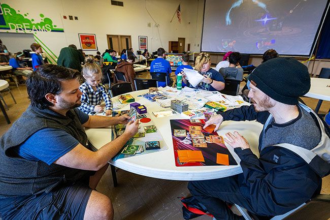 Rachel Thompson/News-Register##Devin St. Clair of Aumsville, left, and Dakota Journey of McMinnville face off in a Pok&eacute;mon card match. Free tournaments in Pok&eacute;mon and Magic: The Gathering, open to all ages, were played alongside video game competitions.