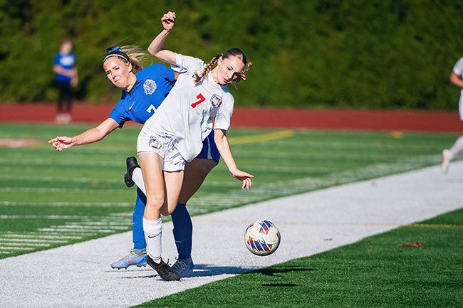 Rusty Rae/News-Register##Eliza Nisly gets physical on a tackle, knocking herself and her opponent over. Creswell was forced to match Amity&rsquo;s physicality after the Warriors made several hard tackles in the first half.