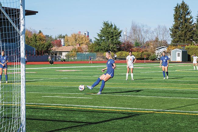 Rusty Rae/News-Register##Eliza Nisly strikes the ball to her right on her penalty kick, scoring Amity&rsquo;s lone goal.