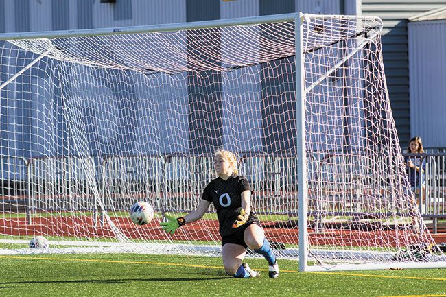 Nathan Ecker/News-Register##Kylie Wilson reels in a Creswell shot attempt in the second half.