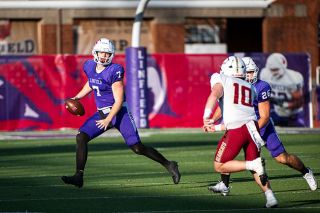 Rusty Rae/News-Register##Junior quarterback Luck McNabb (No. 7) scrambles to his right to find an open receiver during the Wildcats 65-19 victory over the Willamette Bearcats on Saturday, Nov. 15 at Maxwell Field. McNabb had a career high 440 passing yards in the contest, threw for five touchdowns and ran the ball for two scores.