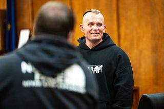 Rusty Rae/News-Register##Adult Recovery Court graduate Mathew Hlibichuk receives words of encouragement from fellow participants and graduates before receiving his certificate of completion from Yamhill County Circuit Judge Ladd Wiles on Nov. 3.