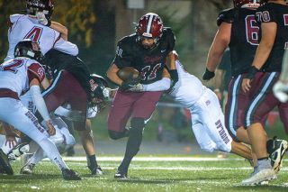 Rusty Rae/News-Register file photo##Stephan Macias escapes a tackle during Dayton’s first-round playoff game against Douglas on Friday, Nov. 7 at Dayton High School. Macias ran for 51 yards and a touchdown, while securing 14 defensive tackles in what ended up as his final high school football game.