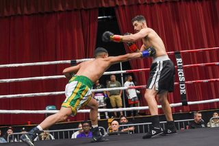 Photo courtesy of Mark Blair##Jose “El Toro” Garcia lands a punch to Luis Iniguez’s abdomen during their duel at the Salem Armory on Nov. 1. Garcia won the match via unanimous decision. It was the first time he had won a fight without a knockout, but still made Iniguez wobbly with a strike to the chin in the fifth round.