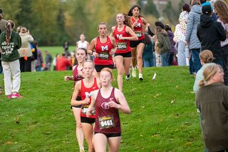 Rusty Rae/News-Register file photo##From left to right: Kathleen Robinson, Josephine McPhillips, Keira Christopherson and Emily Pacheco Segovia run close together during the opening laps of the girls 5,000-meter 6A Pacific Conference Championship race at Joe Dancer Park on Oct. 30. All competed at the NXR Championships in Spokane.
