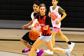 Nathan Ecker/News-Register##Willamina sophomore Bridgette Manley makes an intense bounce pass to a teammate during Bulldogs’ practice at the Willamina High School gymnasium on Wednesday, Nov. 26.