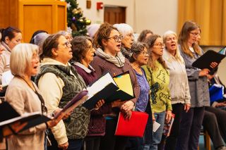 Rachel Thompson/News-Register##Members of the McMinnville Women’s Choir rehearse in the McMinnville First Baptist Church. The choir will perform its winter concert, Shine So Brightly, at 5 p.m. Saturday, Dec. 6, in the church.