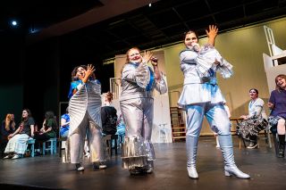 Rusty Rae/News-Register##Characters played by, from left, Ava White, Jayden Smith and Callie James Johnson recall earlier times as they perform “Super Trooper,” a song from “Mamma Mia!,” the musical opening this week at McMinnville High School. In the background are Mary Gormand, left, and Dylan Dawson. The show, based on the songs of ABBA, tells the story of a young woman who invites her dad to her wedding — if she can figure out who he is. Shows are at 7 p.m. Friday and Saturday, Dec. 5 and 6, and Thursday and Friday, Dec. 11 and 12, with a matinee at 2 p.m. Saturday, Dec. 13.