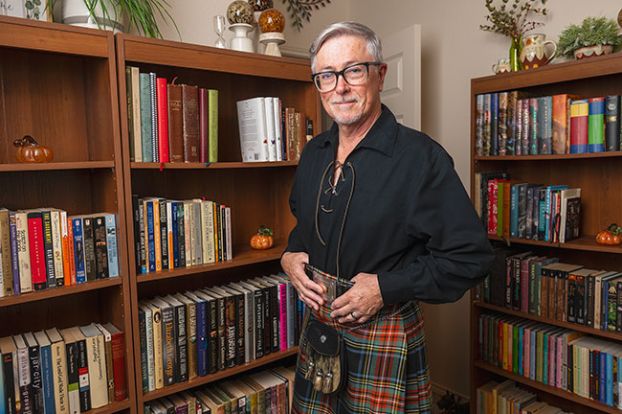 Rusty Rae/News-Register##Stewart Bone of McMinnville wears a kilt from his native Scotland. He loves books, including those by JRR Tolkien. At Christmas, he takes out five of his Bibles and reads the Christmas story in English, German, French, Icelandic and “Broad Scots.”