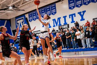 Rusty Rae/News-Register##Amity senior guard Alyssa McMullen raises up from under the basket during the Warriors’ 44-34 victory over Creswell on the second day of the first Warrior Classic on Saturday, Dec. 6 at the Amity High School Gymnasium. McMullen notched her 1000th career point in the game prior and led against Creswell with 13 points.