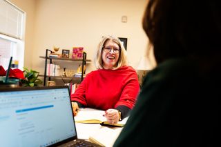 Rusty Rae/News-Register##McMinnville School District Superintendent Kourtney Ferrua talks with Director of Student Services Shelly Simonyi during a meeting in the district office Tuesday. School board members unanimously approved hiring Ferrua as permanent superintendent Monday night.