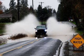Rusty Rae/News-Register##Several days of rain caused high water on some area roadways, including this section of Old Sheridan Road along Cozine Creek near Southwest Mitchell Drive. Dryer weather is expected starting Thursday afternoon, with showers back in the forecast Sunday.