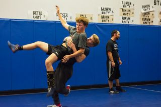 Emily Bonsant/News-Register##Senior Steven Dewees (right) throws junior Julian Schindler at practice. Both wrestlers took second in their weight class on Saturday, Dec. 6 at the Central Linn Dual.