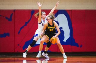 Rusty Rae/News-Register##Linfield senior guard Miki Vermeulen bodies up UWO forward Paige Seckar during the Wildcat&rsquo;s 57-32 loss to the Titans on Friday, Dec. 5 at Ted Wilson gymnasium.