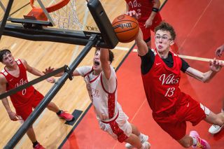 Rusty Rae/News-Register##Grizzlies senior guard Owen Richardson sees a drive to the rim blocked by North Salem junior forward Benjamin Box during Mac&rsquo;s 75-59 loss to the Vikings on Tuesday, Dec. 9, at the McMinnville High School gymnasium.