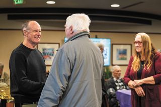 Rusty Rae/News-Register##Dr. Eugene Spear says hello to Gary Clark, one of more than 100 former patients who took time to thank the retired cardiologist for his many years of service to Willamette Valley Medical Center and the community.