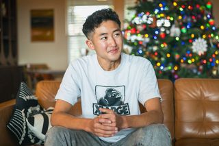 Rusty Rae/News-Register##Tomoki Fuchiyami, a native of Japan, helped decorate the Christmas tree in the home of his host family, the Howards of Amity.