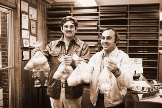 ##(Dec. 12, 1975) Oranges in bags are being sold by JayCees for $1 per bag. Members will be canvassing area door-to-door on Monday. Pictured are Bill Maas, left, and John Youngblutt. JayCees have sold 1100 bags with 700 remaining.
