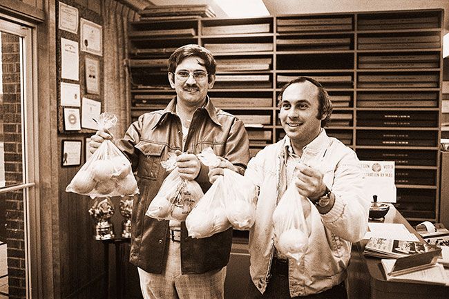 ##(Dec. 12, 1975) Oranges in bags are being sold by JayCees for $1 per bag. Members will be canvassing area door-to-door on Monday. Pictured are Bill Maas, left, and John Youngblutt. JayCees have sold 1100 bags with 700 remaining.