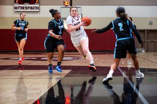 Rusty Rae/News-Register##Junior forward Hadley Hughes barrels toward the basket during the Pirates 53-45 victory over De La Salle North Catholic on Thursday, Dec. 11. Hughes put up 24 points in the contest, and went on to score another 31 points in Dayton&rsquo;s next two games at the Dayton Tournament from Dec. 11-13. Hughes was giving her best effort just days after the passing of her father.