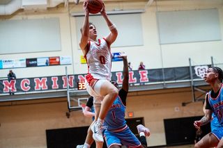 Rusty Rae/News-Register##Grizzlies&rsquo; senior guard Dylan Ferrua gravitates toward the basket during McMinnville&rsquo;s 71-67 victory over McDaniel on Friday, Dec. 12 inside of the McMinnville High School gymnasium.