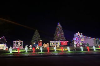 Kirby Neumann-Rea/News-Register##The Davison Auto yard on Northwest Adams forms a Christmas Carnival.
