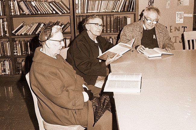##(Dec. 15, 1965) Looking at new books printed in extra-large type now available at the McMinnville Public Library are (I-r) Mrs. Ed Arms of McMinnville, Mrs. Velma Carsh of Yamhill and Charles Goudy of Newberg. There are about 50 volumes available which are on loan from the State Department for the Blind.