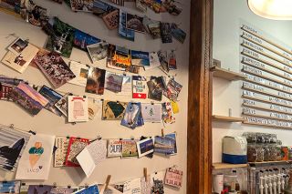 Kirby Neumann-Rea/News-Register##One can peruse the menu and then the postcards at The Common Cup in Amity.