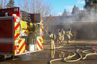 MFD photo##Mac Fire crews respond to a house fire Monday on Wallace Way.