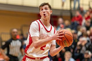 Rachel Thompson/News-Register##Grizzlies&rsquo; senior guard Owen Richardson drives to the hoop in Mac&rsquo;s 52-50 loss against Beaverton on Dec. 27. Richardson nearly won the game by himself, scoring 12 points in the fourth quarter.