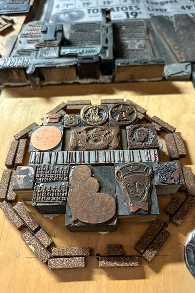 Kirby Neumann-Rea/News-Register##Old print blocks form a newspaper retrospective at what is now Nash & Nichol.