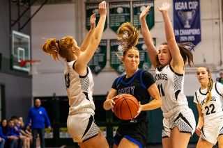 Nathan Ecker/News-Register##Amity senior Adie Nisly drives through a forest of Vale defenders during the green bracket championship game of the Crusader Classic in Salem on Saturday, Jan. 3. Nisly scored 43 points over three games in Turnidge Gymnasium.