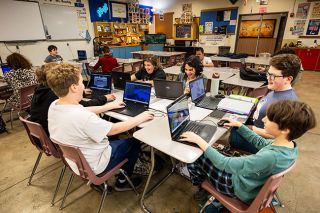 Rachel Thompson/News-Register##Minecraft enthusiasts talking and laughing as they play are, clockwise, Andreas Ippolito (in white shirt), Tor Barclay, Russell Cavitt, Lyra Butterfield, Bennett Mancill and Charlie Schott. The Minecraft Club meets in Patton Middle School&rsquo;s Science, Technology, Engineering and Math classroom.