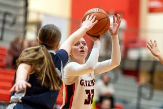 Rachel Thompson/News-Register##Mac junior guard Mabel Findley lines up a 3-point attempt from the left wing during the Grizzlies win over St. Mary&rsquo;s on Jan. 6 in the MHS gymnasium. Findley scored 16 points in the 21-point victory and made two from beyond the arc.
