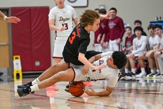 Rusty Rae/News-Register##Dayton freshman Xzavian Patty and Willamina junior Wyatt Hubbell tumble to the floor while chasing a loose ball in the Pirates 58-53 win over the Bulldogs at DHS on Jan. 7. There were several fights for possession as the team&rsquo;s stayed within 10 points of each other all night.