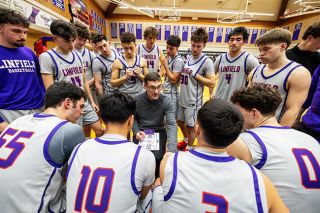 Rachel Thompson/News-Register## Linfield Head Coach Elijah Gurash draws up a play for his squad during their battle with Whitworth inside Ted Wilson Gymnasium on Jan. 10.