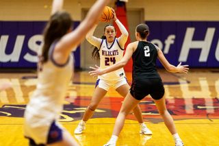 Rachel Thompson/News-Register##Junior center Jadyn Harrell looks for an open pass during Linfield&rsquo;s double-digit victory over Whitworth on Jan. 10 inside Ted Wilson Gymnasium. Harrell had a career-high six points in the win, further establishing the team&rsquo;s mantra that any night can belong to anyone.