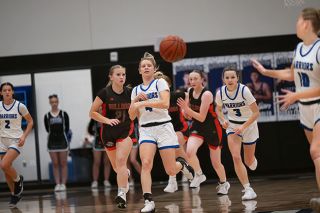 Rusty Rae/News-Register##Haley Miersma pushes up the floor with Alyssa McMullen, connecting with Adie Nisly for a transition bucket in Amity&rsquo;s victory over the Bulldogs on Monday, Jan. 11 at the Warrior Gymnasium