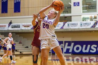 Nathan Ecker/News-Register##Allie Mead drives past a defender in Linfield&rsquo;s victory over Willamette on Tuesday, Jan. 13 at Ted Wilson Gymnasium. Mead was efficient, going 3-for-4 from the field and 2-for-2 on free throws while commanding the Cats offense in transition.