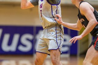 Rachel Thompson file photo/News-Register##Linfield junior forward Garrett Callsen posts up against a Whitworth defender in the Cats home game versus the Pirates on Saturday, Jan. 10. Callsen provided heroics for the Cats at Puget Sound on Jan. 16, giving Linfield its second win at the buzzer in conference play.