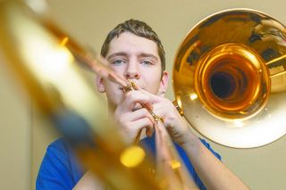 Rachel Thompson/News-Register##Rex Kamper plays his favorite trombone, a Yamaha that features an F-attachment &mdash; a special valve that helps him hit low notes. His father played trombone, so Rex chose the instrument too. He also plays drums with McMinnville High School&rsquo;s marching band.
