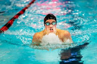Rusty Rae/News-Register##Mac senior Mitchell Ronning breaks out of the water and ahead of the pack during his 100-yard breastroke victory at the Grizzlies&rsquo; senior night dual against Glencoe at the McMinnville Aquatic Center on Thursday, Jan. 22. Despite finishing four seconds slower than his personal best, Ronning still beat Glencoe&rsquo;s second-place finisher by 5.05 seconds.
