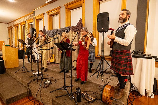 Rachel Thompson/News-Register##left, Jeremy Moldovan-Trujillo, Joseph Linahon and Nolan Lynch &mdash; were joined onstage by guest fiddlers Mike Hryekewicz and Debbie Kimery of Portland and Nancy Jarrell of St. Helens.